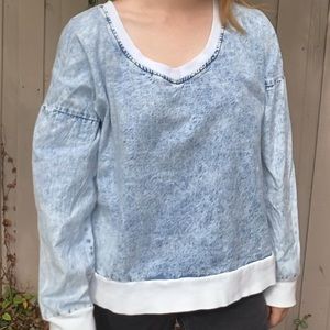 An oversized jean-like sweater